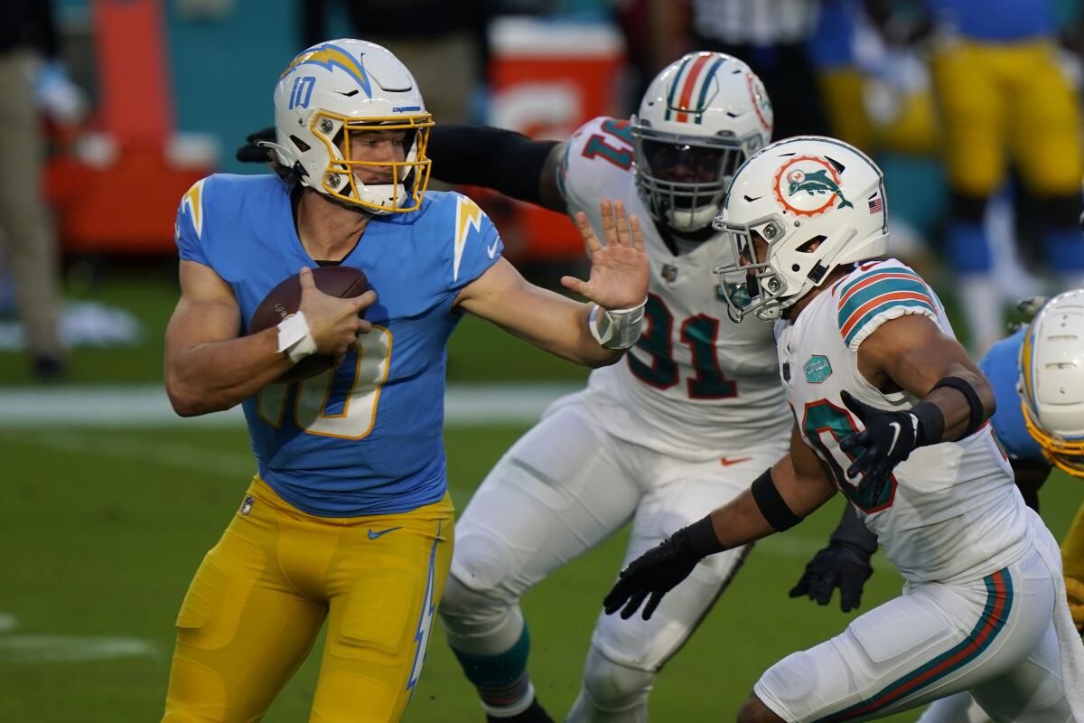 Running back Salvon Ahmed of the Miami Dolphins runs against the Las