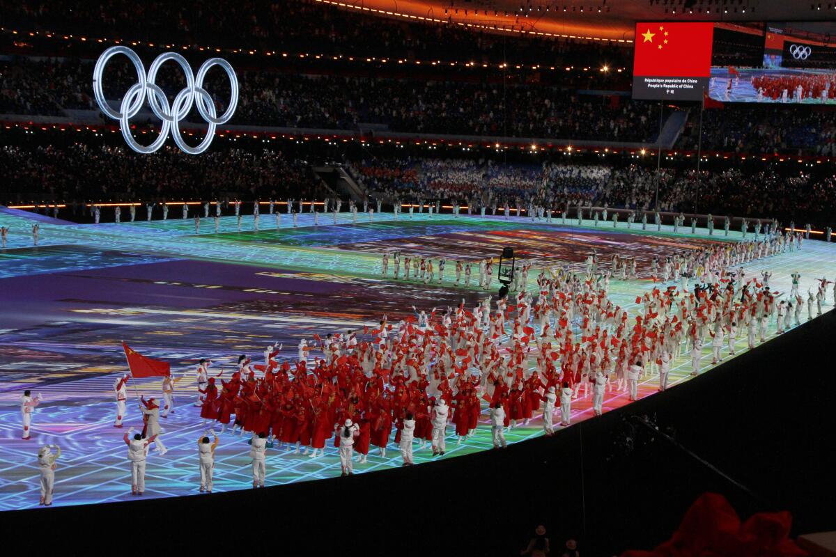 Chinese athletes march at the 2022 Olympics.