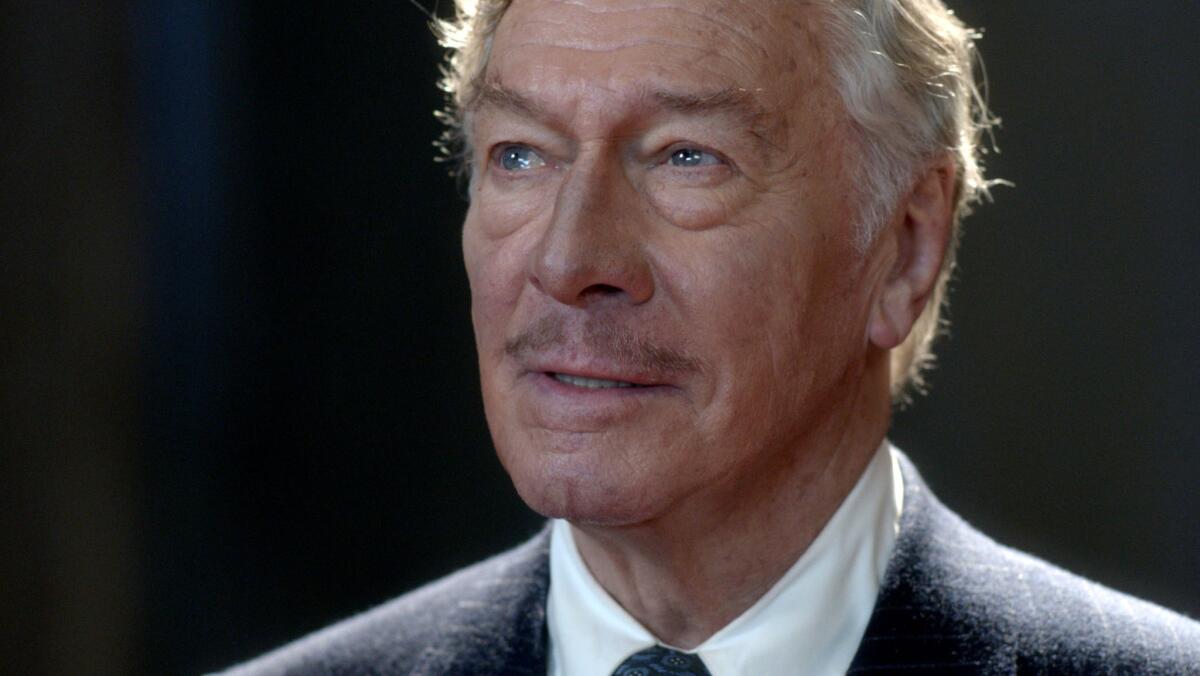 A headshot of Christopher Plummer in a suit and tie