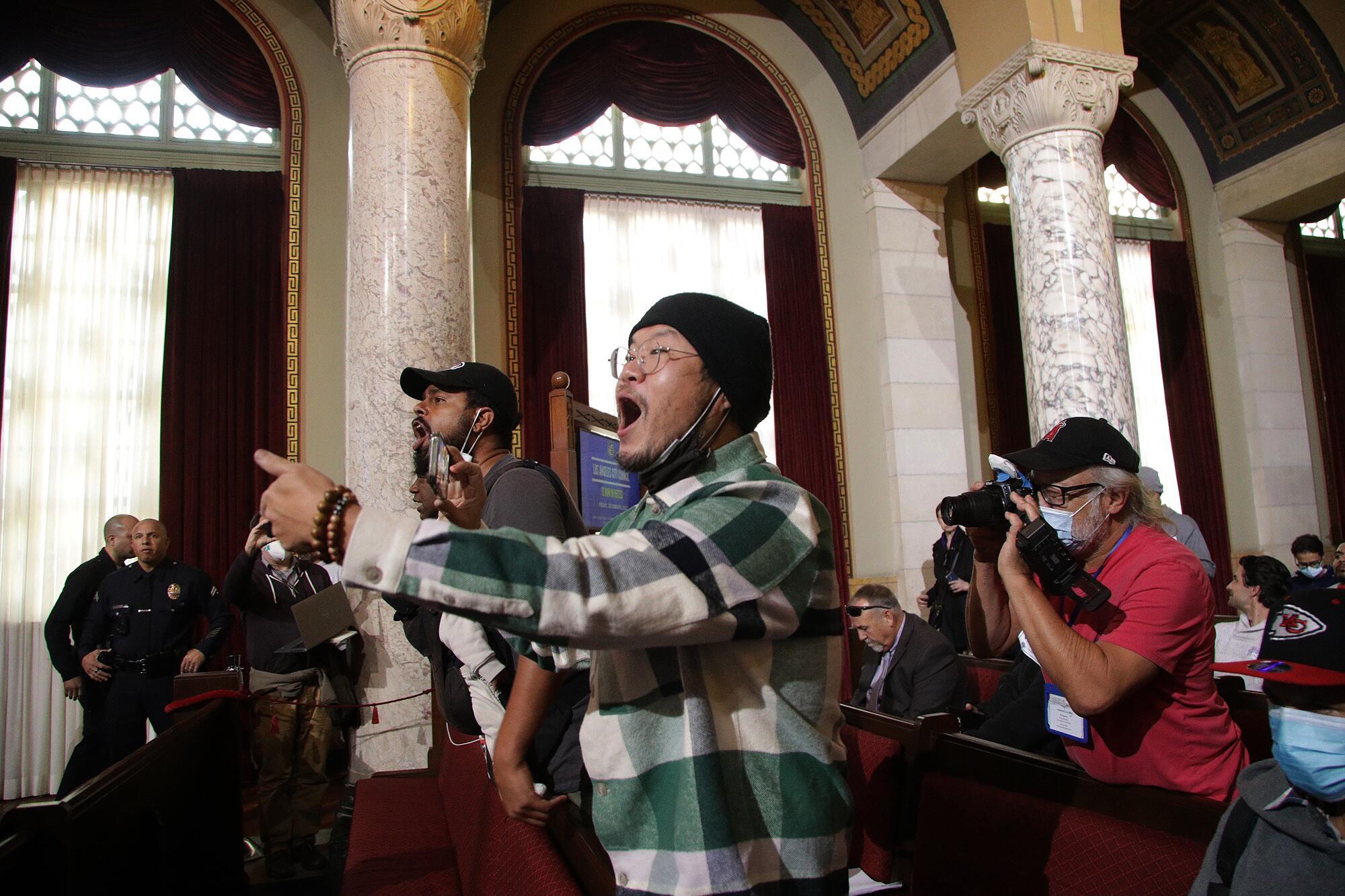 Protestors get vocal about Kevin de León inside the Los Angeles City Council chambers.