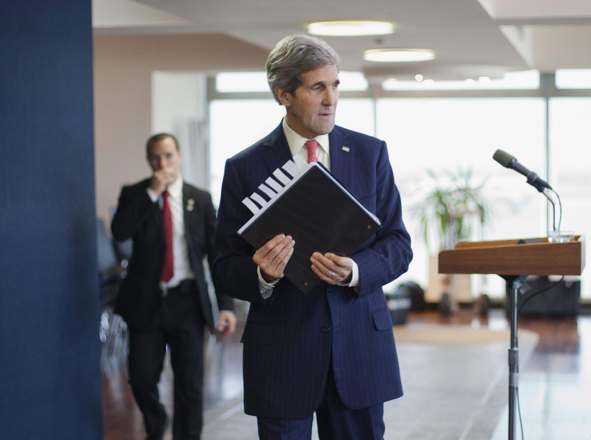 U.S. Secretary of State John F. Kerry walks away from the lectern after answering questions from the media in Tel Aviv on Friday.