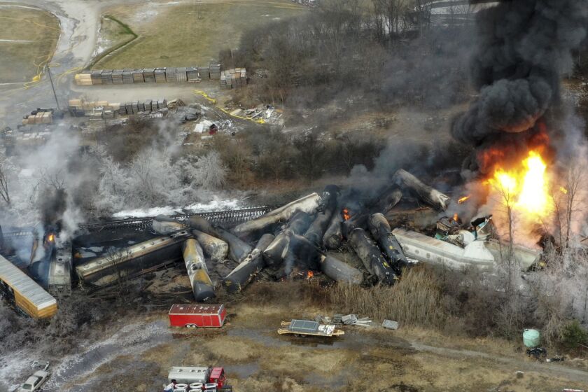 FILE - This photo taken with a drone shows portions of a Norfolk and Southern freight train that derailed the night before in East Palestine, Ohio, on Feb. 4, 2023. The Federal Railroad Administration recently completed a review of Norfolk Southern's safety culture done in the wake of the fiery Feb. 3 derailment in Ohio, and officials plan to follow up with similar investigations of all the major freight railroads over the next year. (AP Photo/Gene J. Puskar, File)
