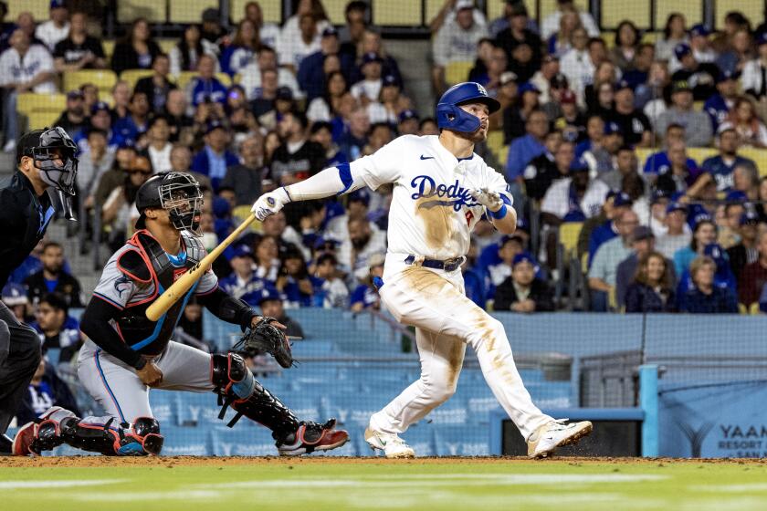 LOS ANGELES, CA - MAY 7, 2024: Los Angeles Dodgers second base Gavin Lux (9) watches his 2-run homer run clear the right field wall against the Miami Marlins in the third inning at Dodger Stadium on May 7, 2024 in Los Angeles, California.(Gina Ferazzi / Los Angeles Times)