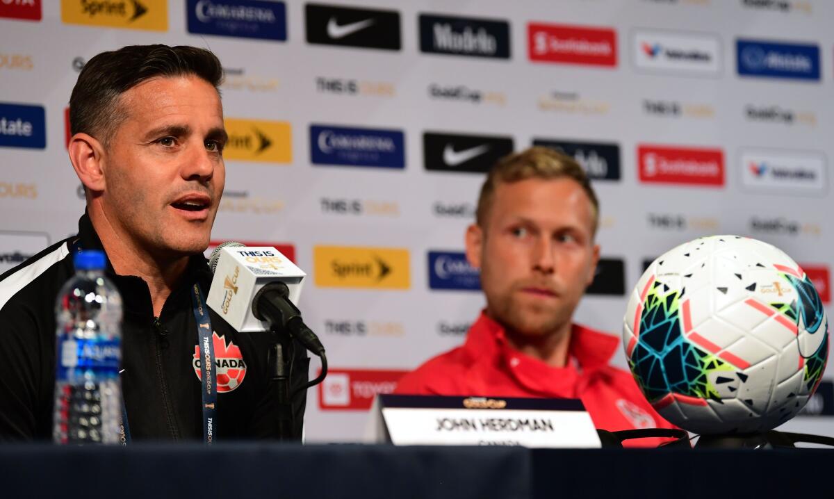 Canada coach John Herdman responds to questions during a CONCACAF Gold Cup news conference June 14.