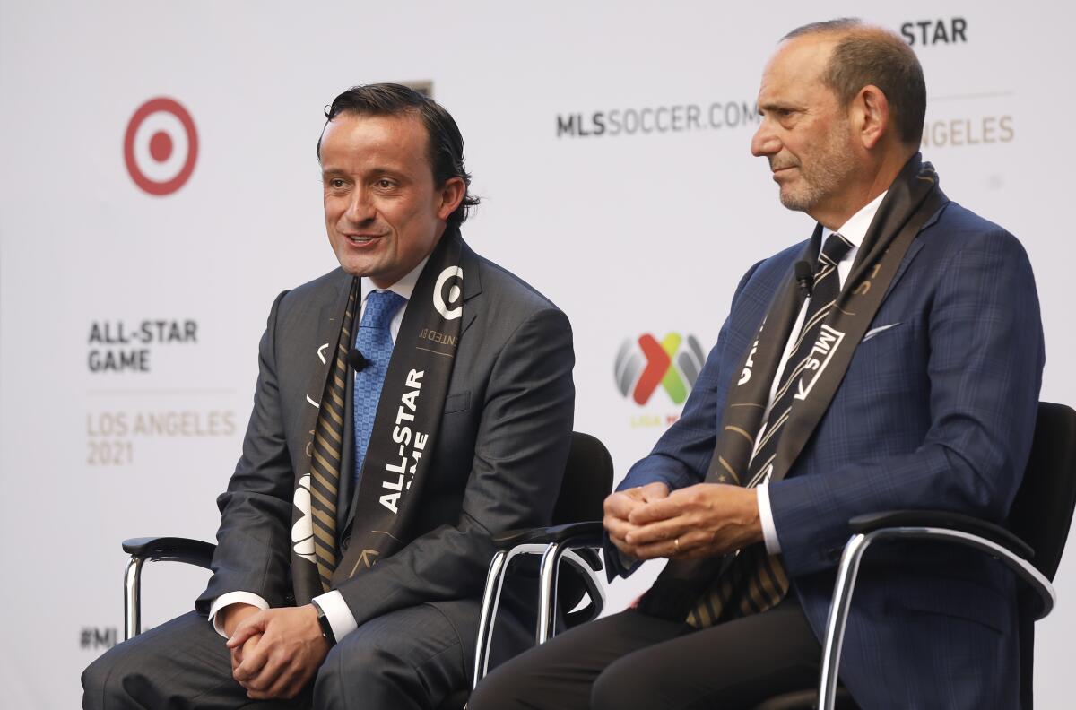 MLS commissioner Don Garber, right, and Liga MX executive president Mikel Arriola, left, speak at a press conference
