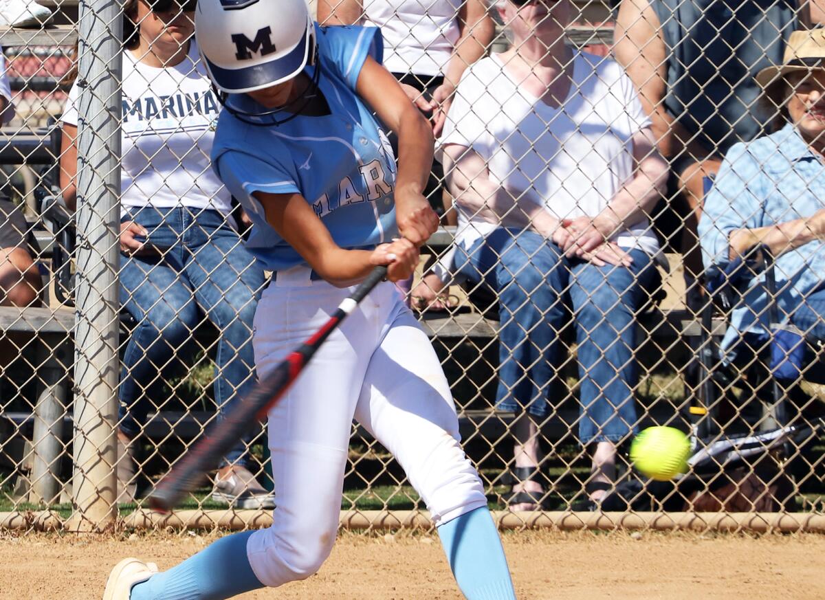 Marina's Rachel Ruiz hits a two-run home run to take the lead against St. Paul in a CIF Division 3 softball playoff game.
