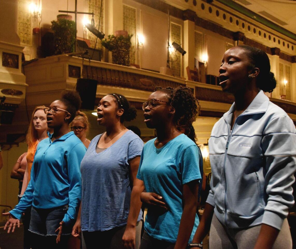 Actresses from right, Shalom Imo-Osage, Dominique Thurman, Llogan Peters and Randall Mckinney sings Carmen Blue during a practice rehearsal at the Baltimore School for the Arts.