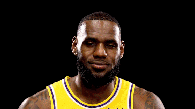 LeBron James strikes different poses during a media day photo and video session.