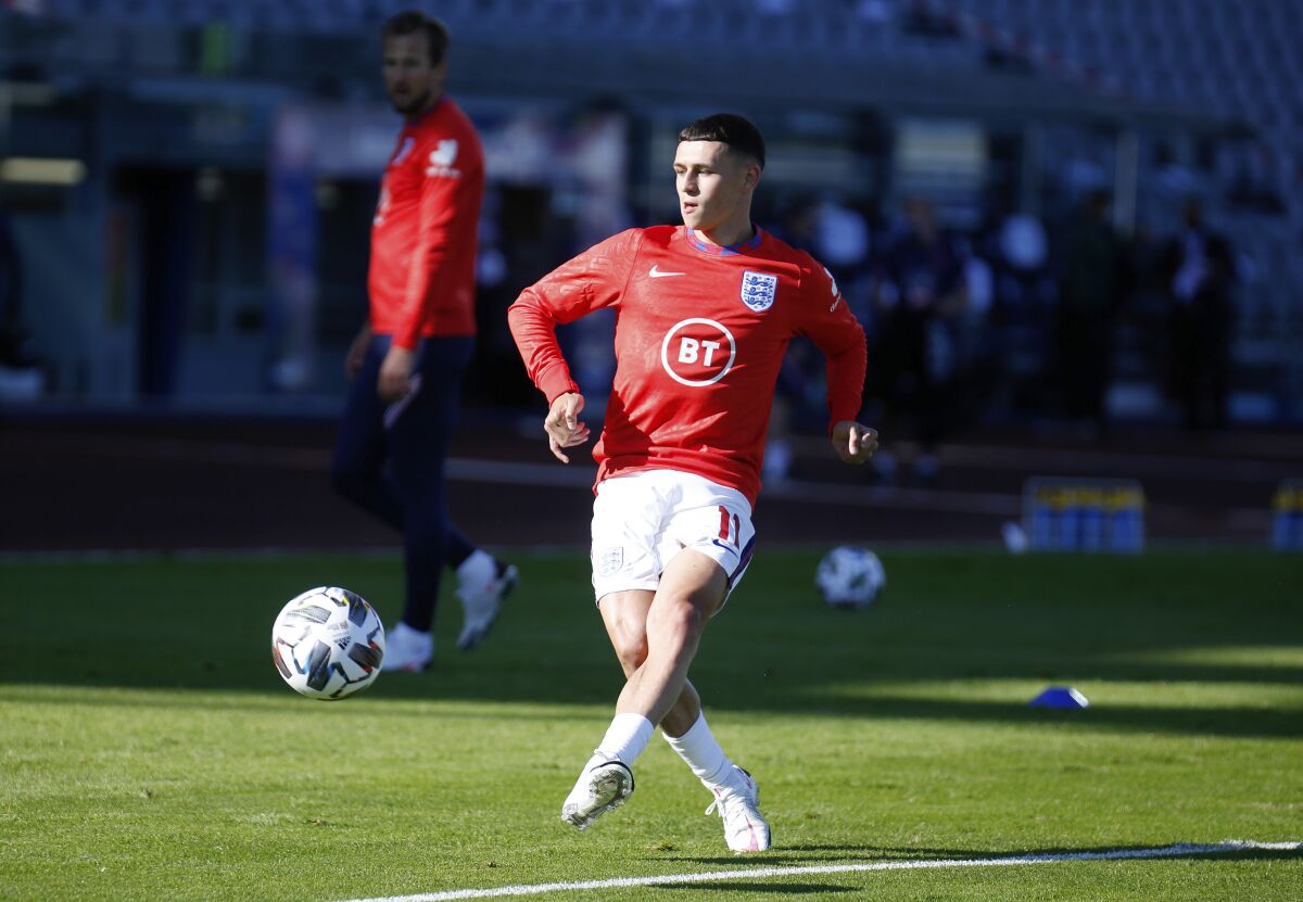England's Phil Foden warms-up before the UEFA Nations League soccer match between Iceland and England in Reykjavik, Iceland, Saturday, Sept. 5, 2020. (AP Photo/Brynjar Gunnarson)