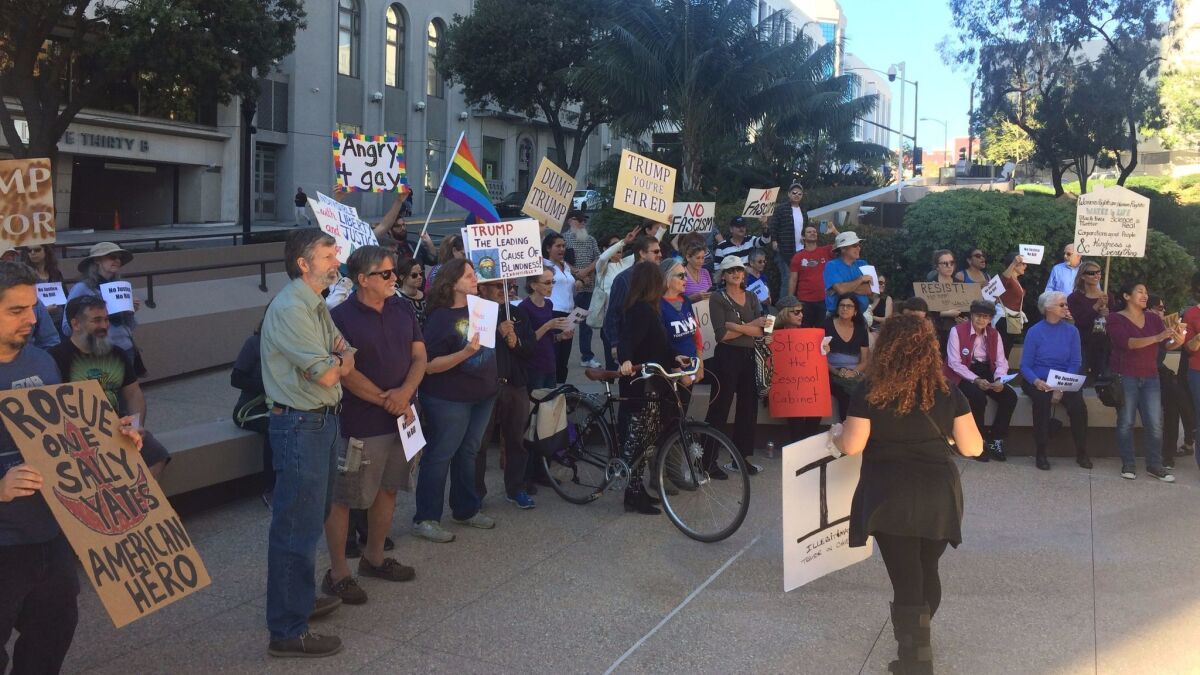 Around 60 protesters for "Resist Trump Tuesdays" outside the building, which houses the San Diego office of U.S. Sen. Kamala Harris.