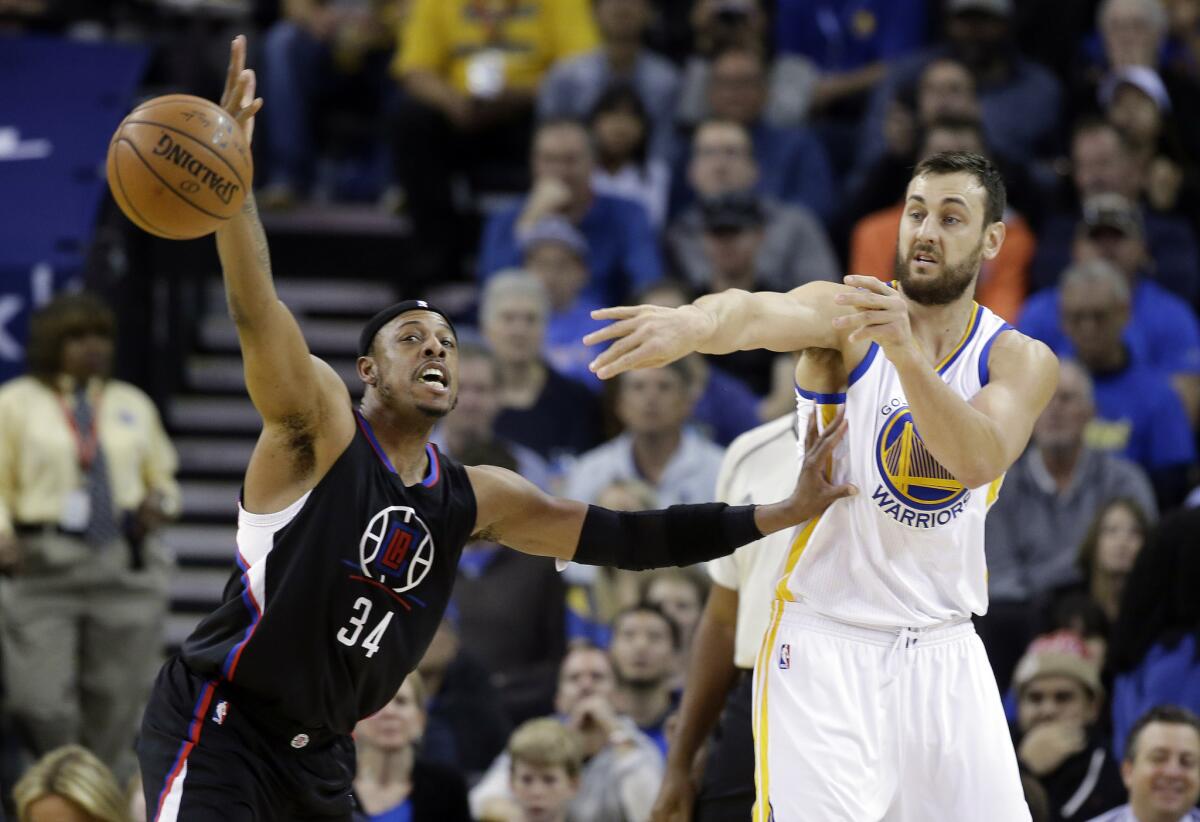 Clippers forward Paul Pierce (34) defends against Warriors center Andrew Bogut during the first half.