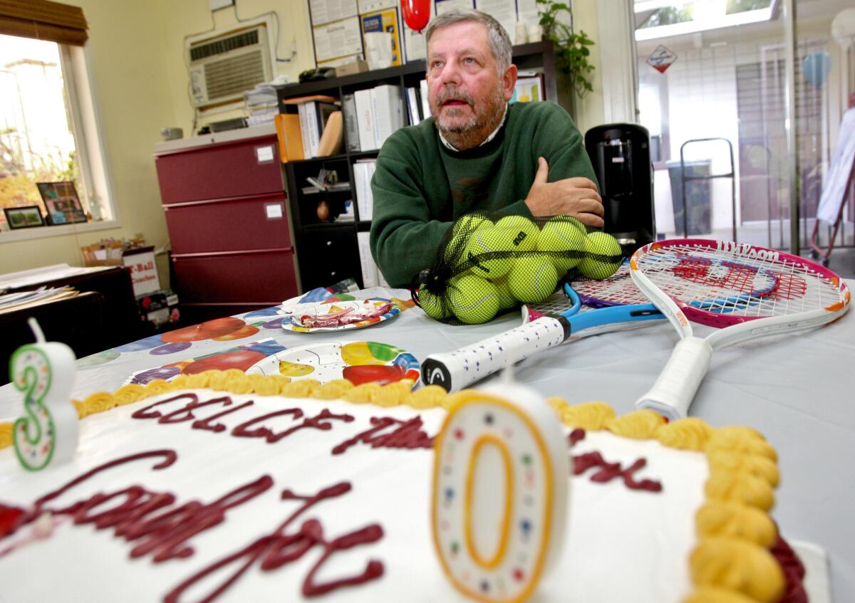 Tennis coach Joe Steckermeier, who has been teaching tennis to children and youth for 30 years at the Community Center of La Cañada Flintridge, got a cake to celebrate the occassion at the community center in La Cañada Flintridge on Wednesday, May 25, 2016.