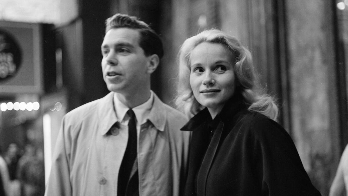 Actress Eva Marie Saint and her husband, Jeffrey Hayden, walk in Los Angeles in 1957. The couple met in 1949 in the subway corridors under Rockefeller Center.