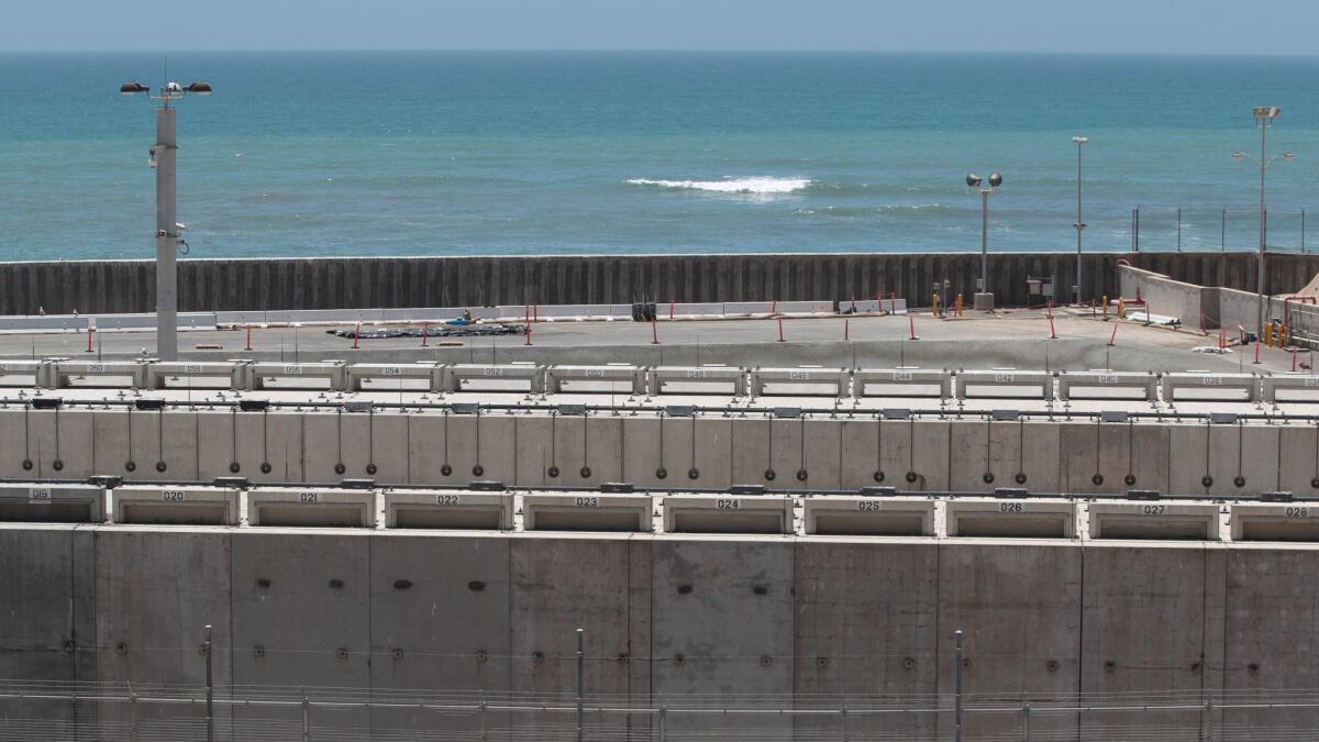 Some of the 3.55 million pounds of spent fuel at the San Onofre Nuclear Generating Station rests in dry cask storage within sight of the Pacific Ocean. From a 2016 file photo.