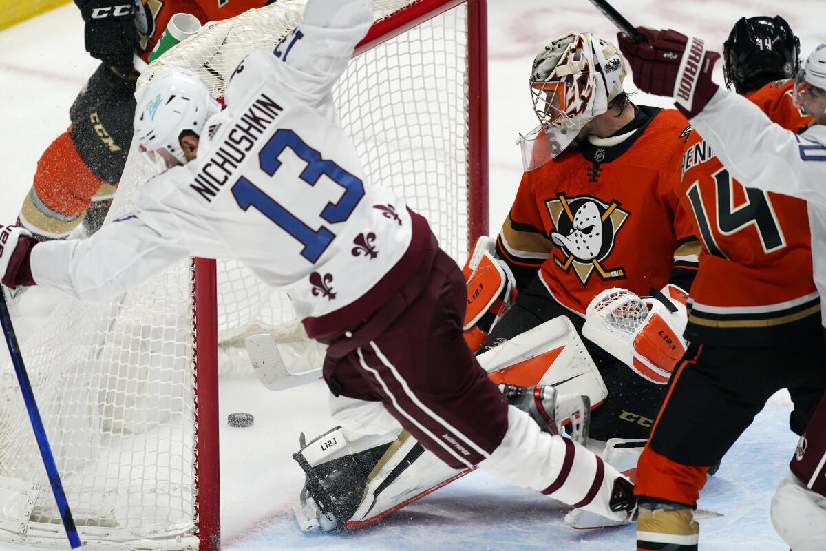 Ducks goalie John Gibson looks back into the net on the winning goal by Colorado's Valeri Nichushkin (13) on March 5, 2021.