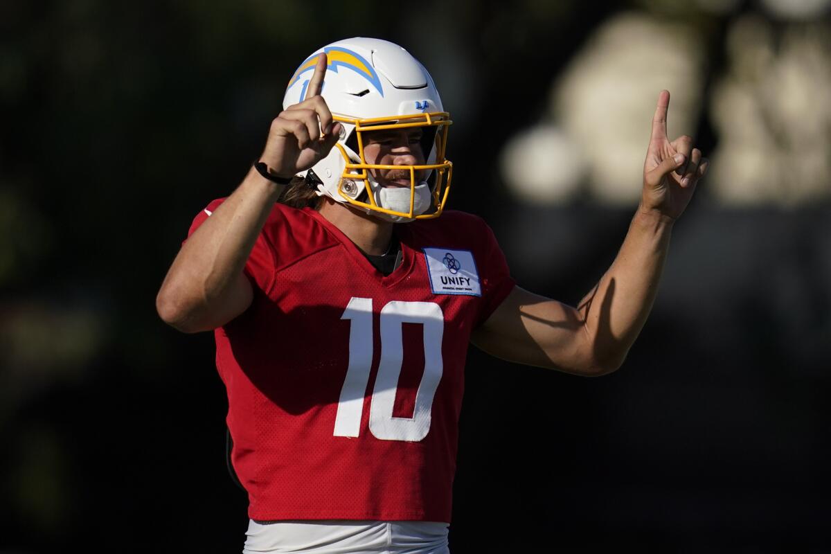 Chargers quarterback Justin Herbert gestures during the team's intrasquad scrimmage in Costa Mesa on Sunday night.