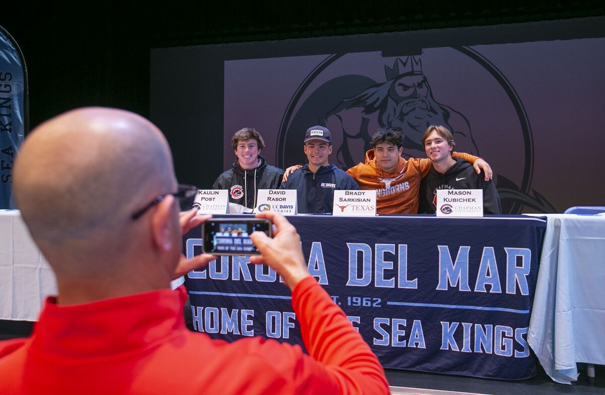 Kaulin Post, left, David Rasor, Brady Sarkisian and Mason Kubichek pose for a photo during the Corona del Mar signing day.