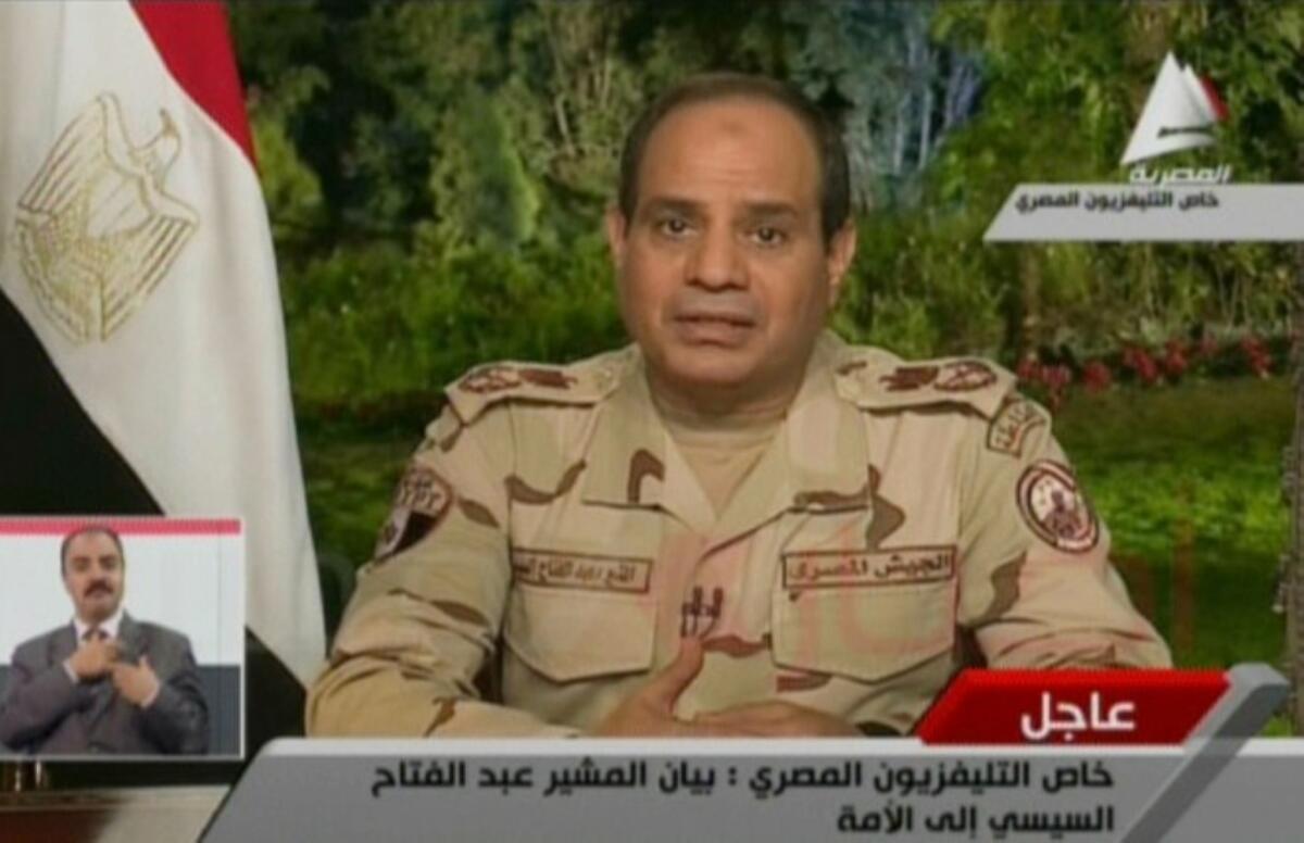 An image taken from Egyptian state television shows Field Marshal Abdel Fattah Sisi on Wednesday announcing his resignation from his military position to run for president.