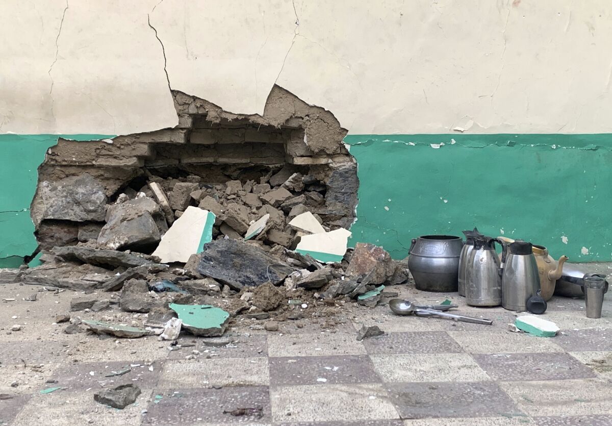 The damaged wall of a mosque in Kandahar, Afghanistan.