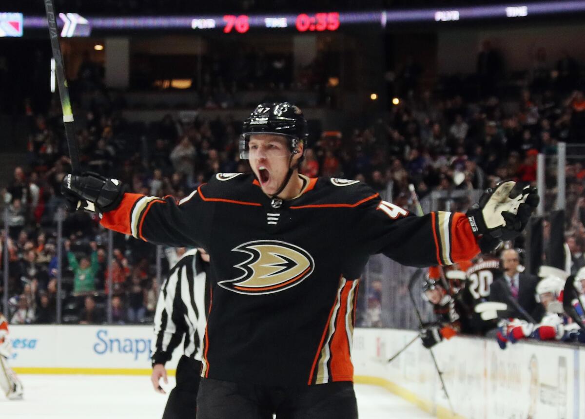 The Ducks' Hampus Lindholm celebrates his power-play goal that tied the score late in the third period.