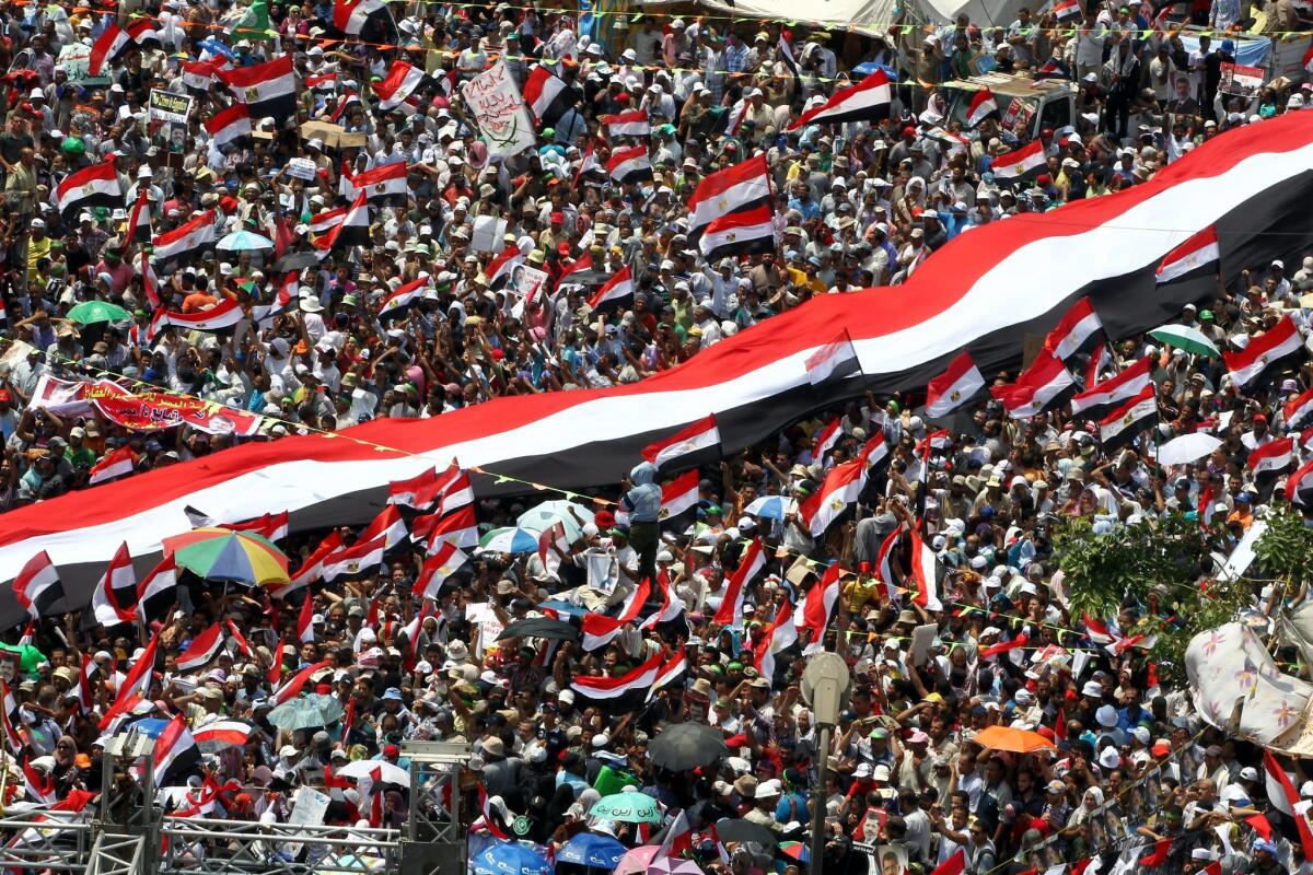 Supporters of Egypt's ousted president, Mohamed Morsi, rally outside the Rabaa Al Adawiya mosque in Cairo.