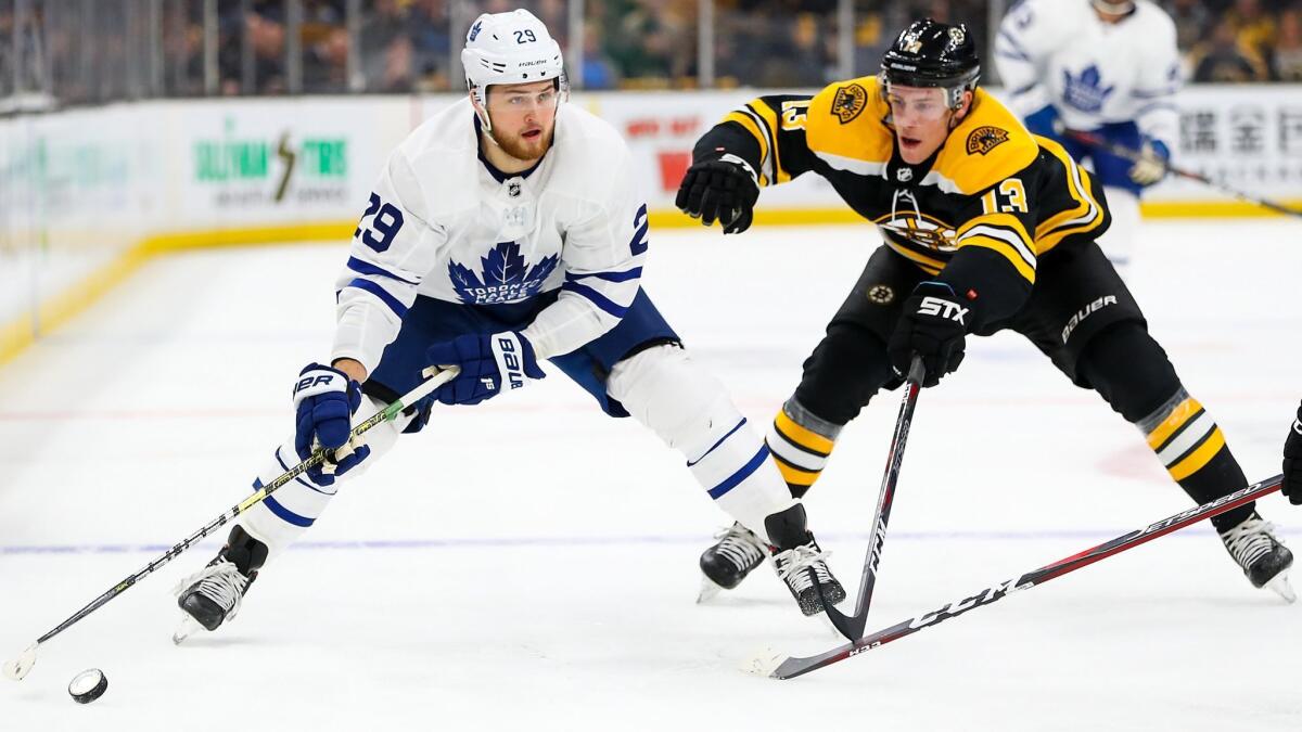 Toronto Maple Leafs' William Nylander (29) skates with the puck trailed by Boston Bruins' Charlie Coyle (13) in the second period of Game 1 of the Eastern Conference first round during the NHL playoffs on Thursday.