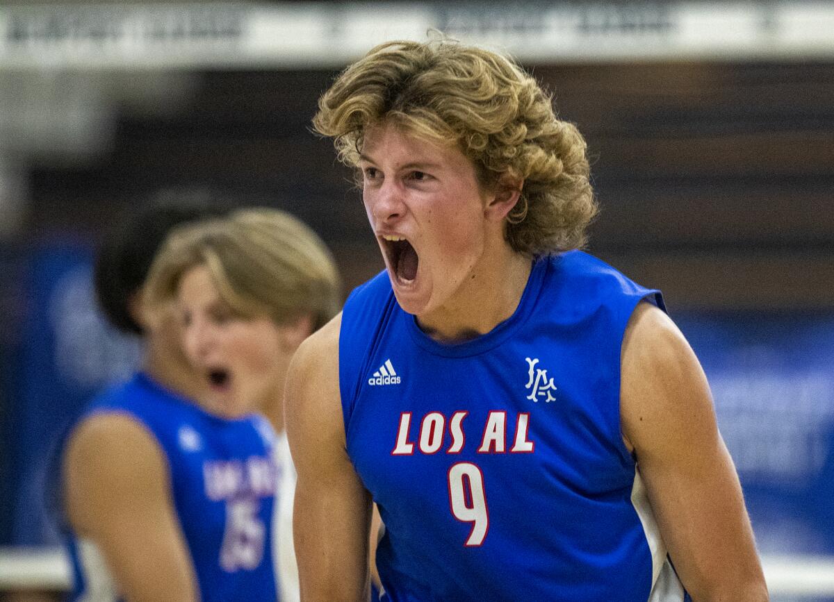 Los Alamitos' Noah Roberts celebrates after winning a point against Newport Harbor on Tuesday.