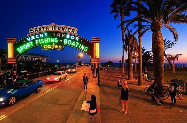 An archway leading to the Santa Monica Pier.