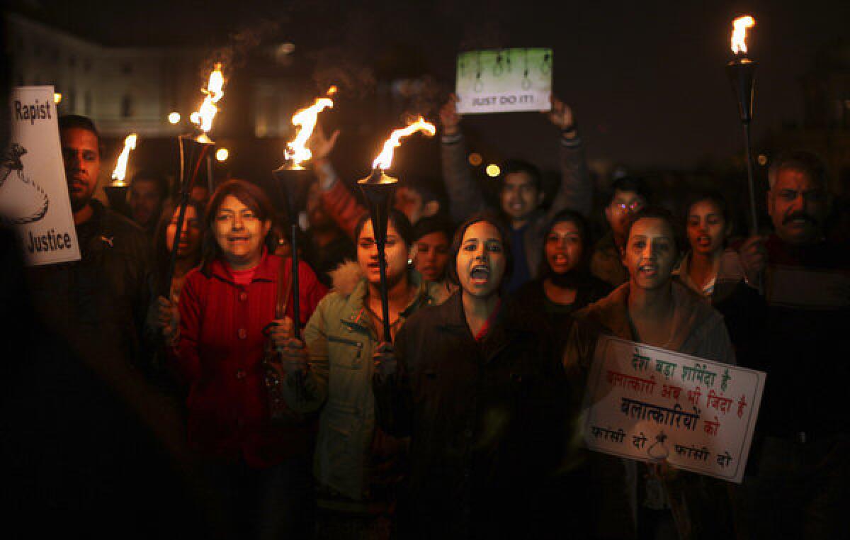 Indian protesters angered by a case of gang rape shout slogans as they march near the president's home in New Delhi.