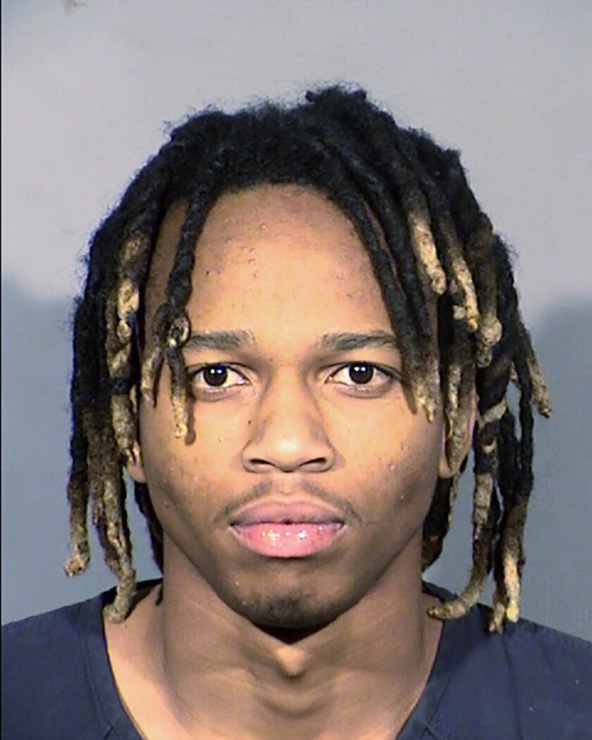 This undated photo provided by the Clark County Detention Center shows Jesani Carter, 20, following his arrest, Dec. 31, 2021. A Las Vegas judge said Tuesday, Jan. 4, 2022 she’ll decide next week whether to grant bail to Carter, one of two men facing felony murder charges in the shooting deaths of two people during what police said were a series of New Year's Eve robberies. (Clark County Detention Center via AP)