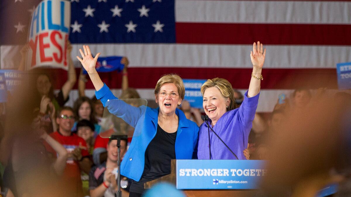 Democratic presidential candidate Hillary Clinton is introduced by Sen. Elizabeth Warren, D-Mass., at a rally in Cincinnati on June 27.