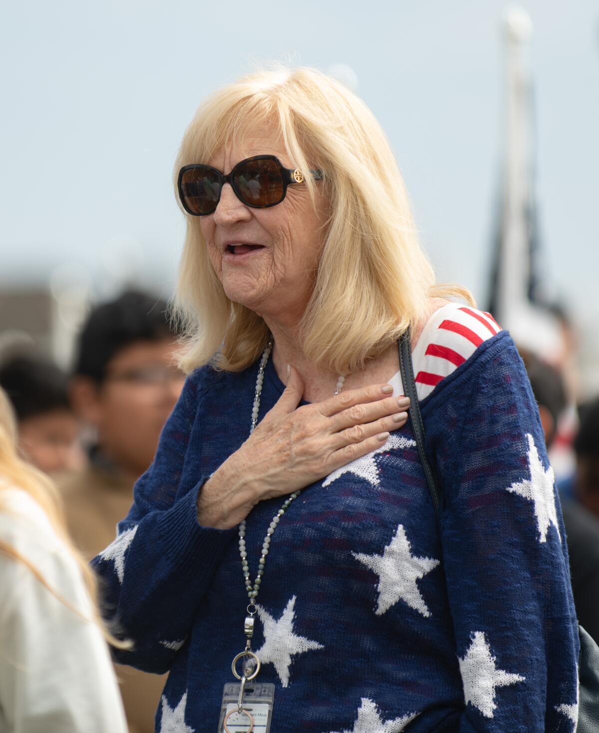 NMUSD teacher Pati Chadwell during the Pledge of Allegiance at Castaways Park Thursday.