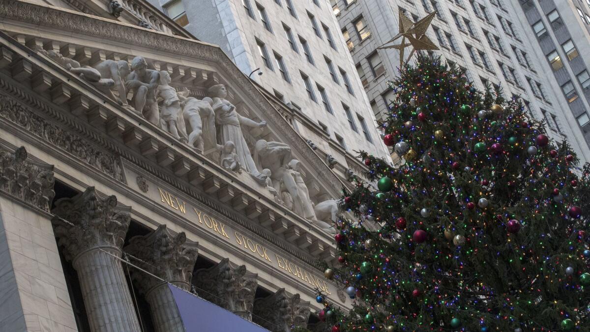 A Christmas tree stands in front of the New York Stock Exchange.