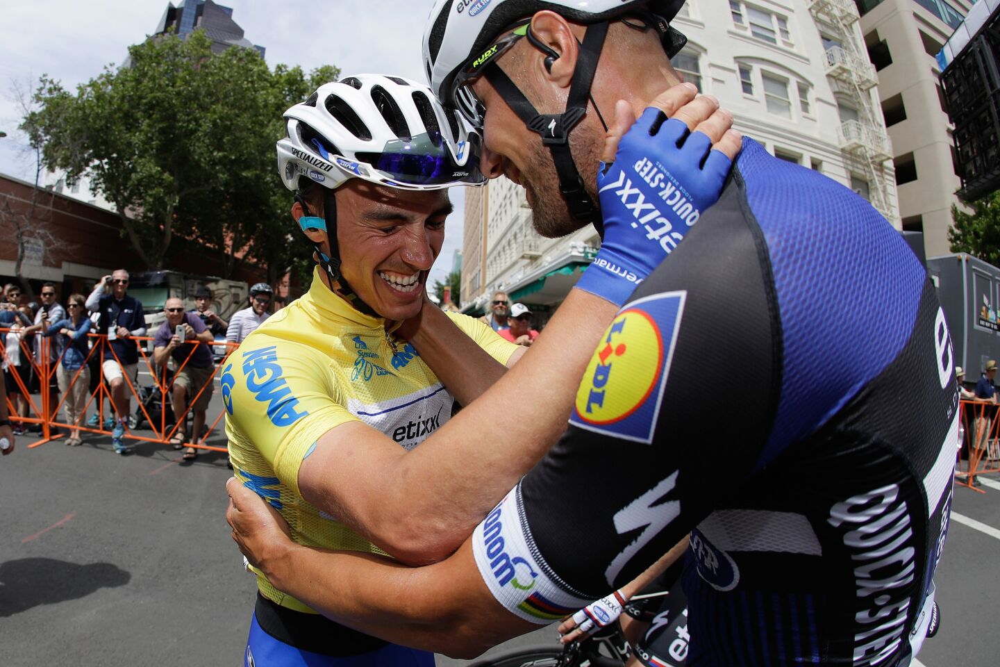 Julian Alaphilippe, left, is congratulated by Etixx/Quick-Step teammate Tom Boonen after clinching the overall title for the Amgen Tour of California on May 22 in Sacramento.