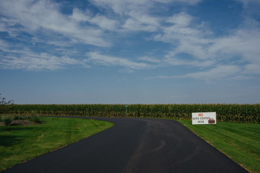A “No Data Center Here” sign at the end of a street in the Branden Hills neighborhood near the proposed QTS data center site on the outskirts of Clinton, Iowa. Photographer: Jamie Kelter Davis/Bloomberg