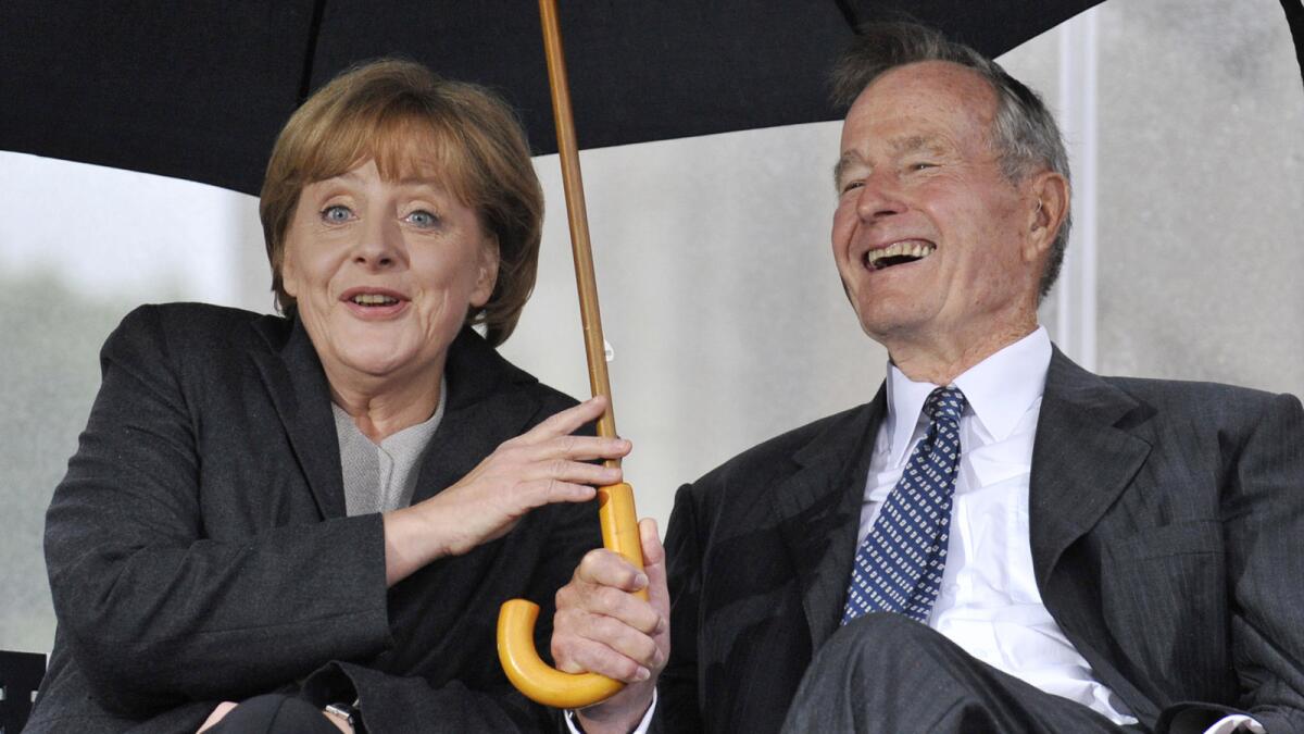 Former President George H.W. Bush and German Chancellor Angela Merkel at a July 2008 ceremony to inaugurate the new U.S. Embassy building in Berlin.