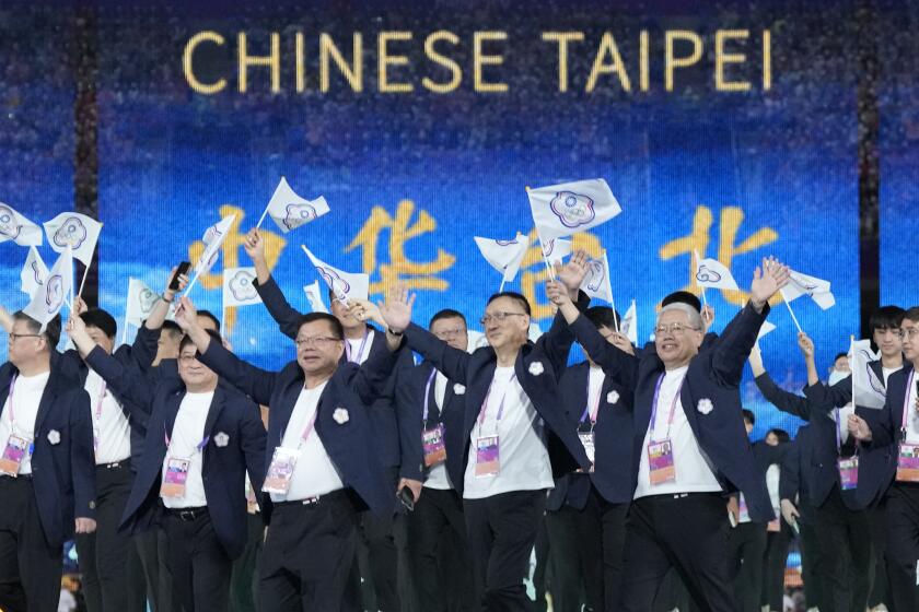 Taiwan's athletes and team officials arrive during the opening ceremony of the 19th Asian Games in Hangzhou, China, Saturday, Sept. 23, 2023. At the Asian Games China has been going out of its way to be welcoming to the Taiwanese athletes, as it pursues a two-pronged strategy with the goal of taking over the island, which involves both wooing its people while threatening it militarily. (AP Photo/Lee Jin-man, File)