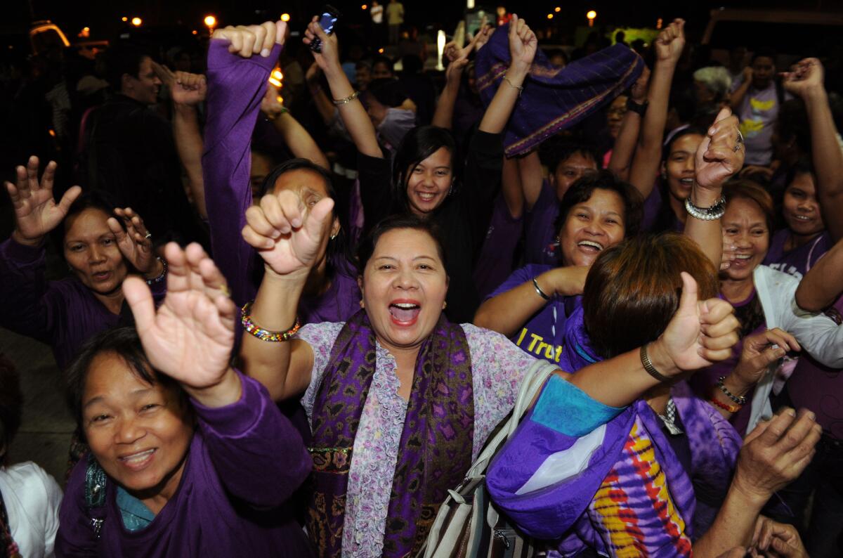 Supporters celebrate passage of the reproductive health bill in the Philippines' House of Representatives in December.