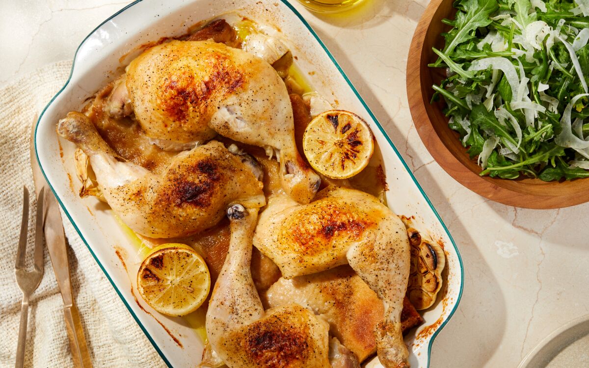 Breads roasts under chicken legs to become crispy and saturated in chicken juices in this one-pot dish.