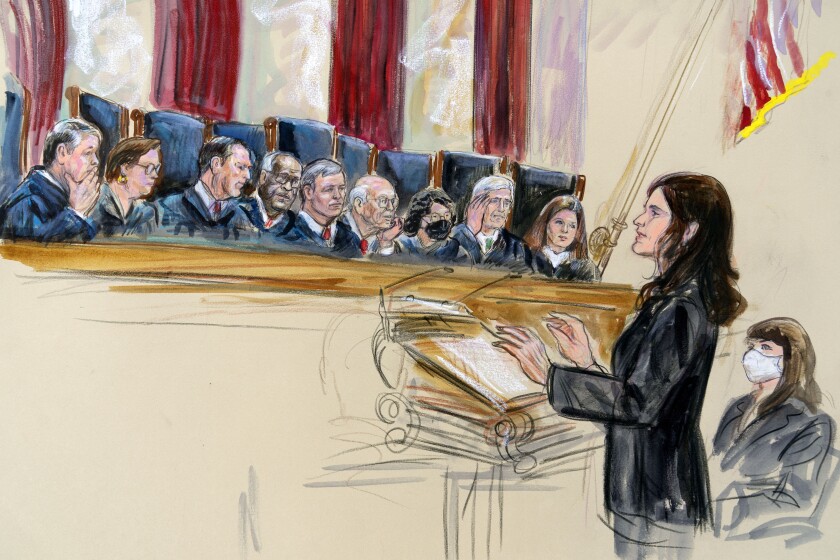 This artist sketch depicts Center for Reproductive Rights Litigation Director Julie Rikelman speaking to the Supreme Court, Wednesday, Dec. 1, 2021, in Washington. Seated to Rikelman's right is Solicitor General Elizabeth Prelogar. Justices seated from left are Associate Justice Brett Kavanaugh, Associate Justice Elena Kagan, Associate Justice Samuel Alito, Associate Justice Clarence Thomas, Chief Justice John Roberts, Associate Justice Stephen Breyer, Associate Justice Sonia Sotomayor, Associate Justice Neil Gorsuch and Associate Justice Amy Coney Barrett. (Dana Verkouteren via AP)