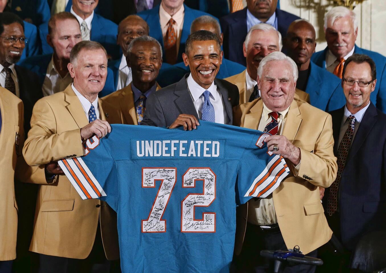 U.S. President Obama honors the 1972 season Miami Dolphins, the NFL Superbowl-winning football team in the East Room of the White House in Washington