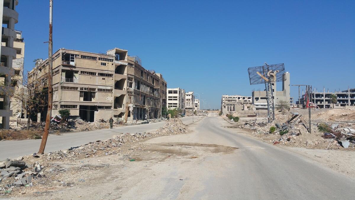 An entrance to Layramoun, an industrial zone near Aleppo, Syria, shows devastation as a result of the Syrian civil war.