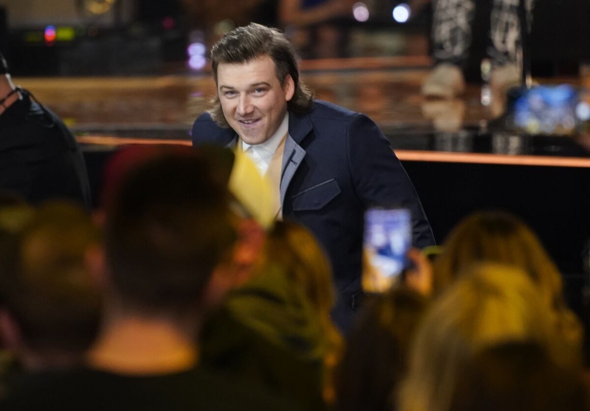Morgan Wallen accepts the award for album of the year for "Dangerous: The Double Album" at the 57th Academy of Country Music Awards on Monday, March 7, 2022, at Allegiant Stadium in Las Vegas. (AP Photo/John Locher)