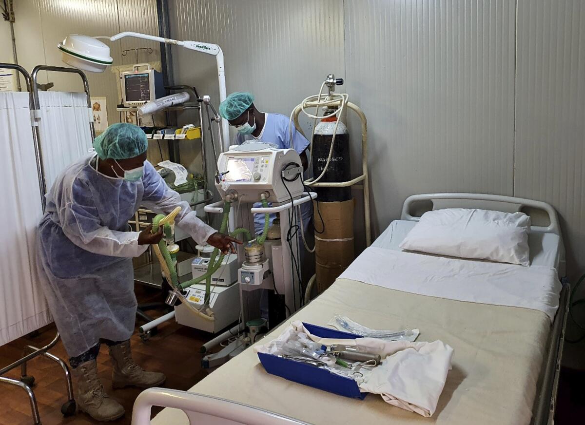 U.N. nurses check equipment at a hospital in central Darfur in preparation for COVID-19 patients. 