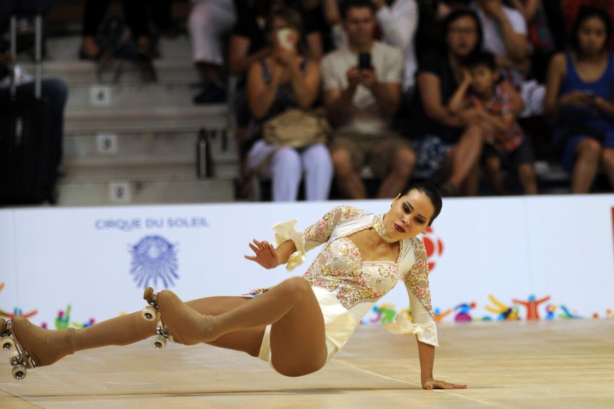 Argentinian competitor Giselle Soler falls during the Roller Sport-Figure Skating Final competition at the 2015 Pan American Games in Toronto, Canada, on July 12, 2015. AFP PHOTO/HECTOR RETAMALHECTOR RETAMAL/AFP/Getty Images ** OUTS - ELSENT, FPG - OUTS * NM, PH, VA if sourced by CT, LA or MoD **