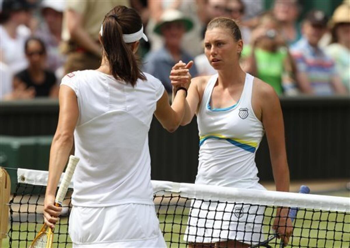Russia's Vera Zvonareva, right, shakes hands with Tsvetana Pironkova of Bulgaria, after winning their women's singles semifinal on the Centre Court at the All England Lawn Tennis Championships at Wimbledon, Thursday, July 1, 2010. (AP Photo/John Super)