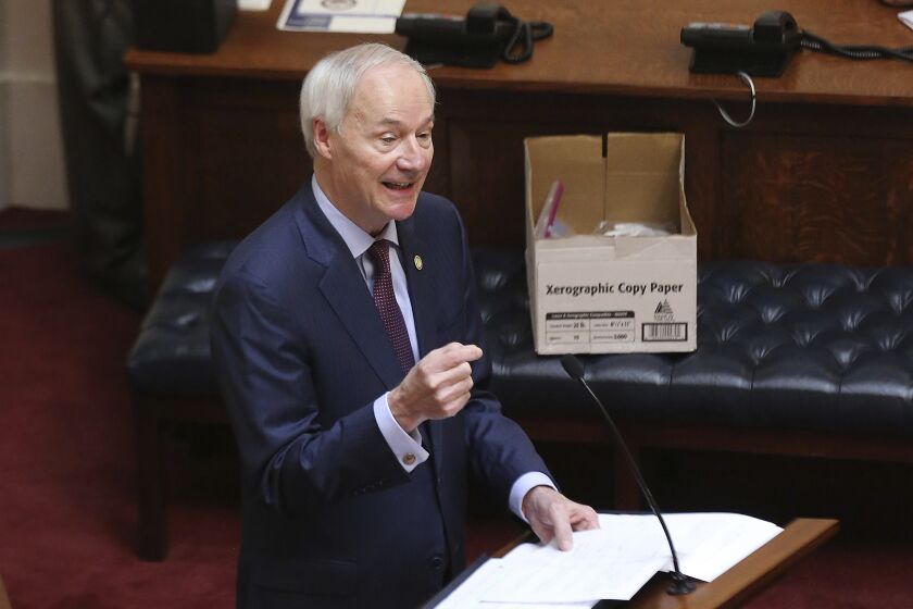 In this April 8, 2020 photo, Arkansas Gov. Asa Hutchinson gives the State of the State