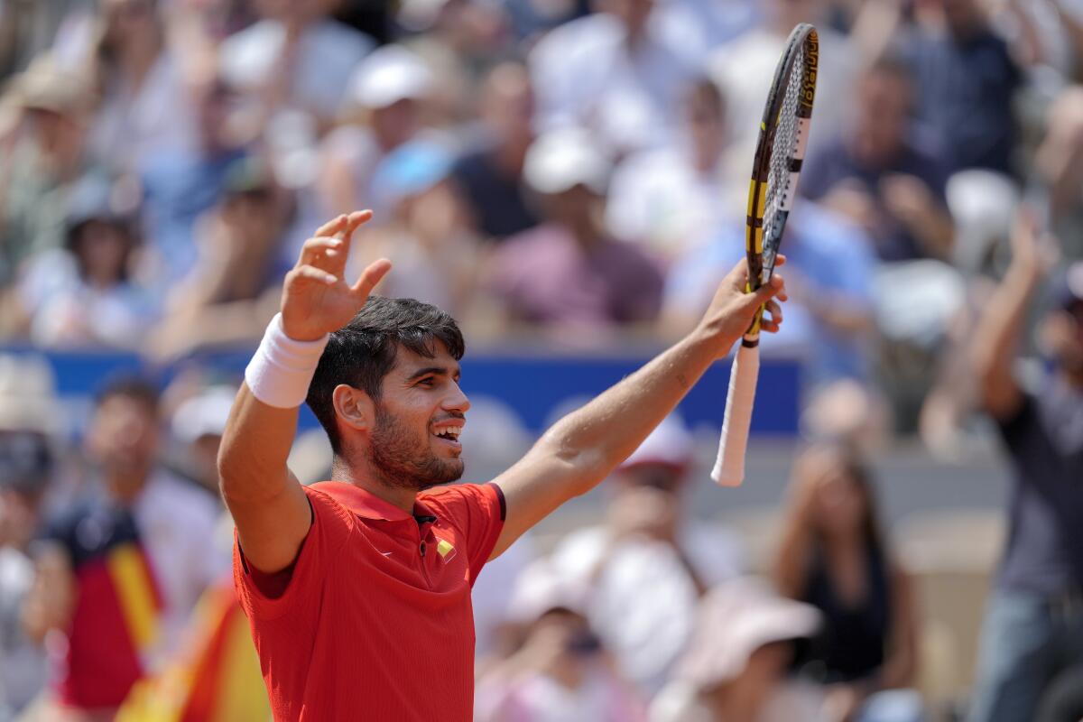 Carlos Alcaraz of Spain celebrates after defeating Canada's Felix Auger-Aliassime.