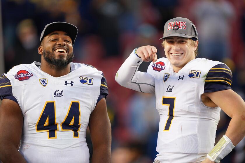 SANTA CLARA, CALIFORNIA - DECEMBER 30: (L-R) California Golden Bears defensive player of the game Zeandae Johnson #44 and offensive player of the game Chase Garbers #7 celebrates after California defeated the Illinois Fighting Illini 35-20 in the RedBox Bowl at Levi's Stadium on December 30, 2019 in Santa Clara, California. (Photo by Thearon W. Henderson/Getty Images)