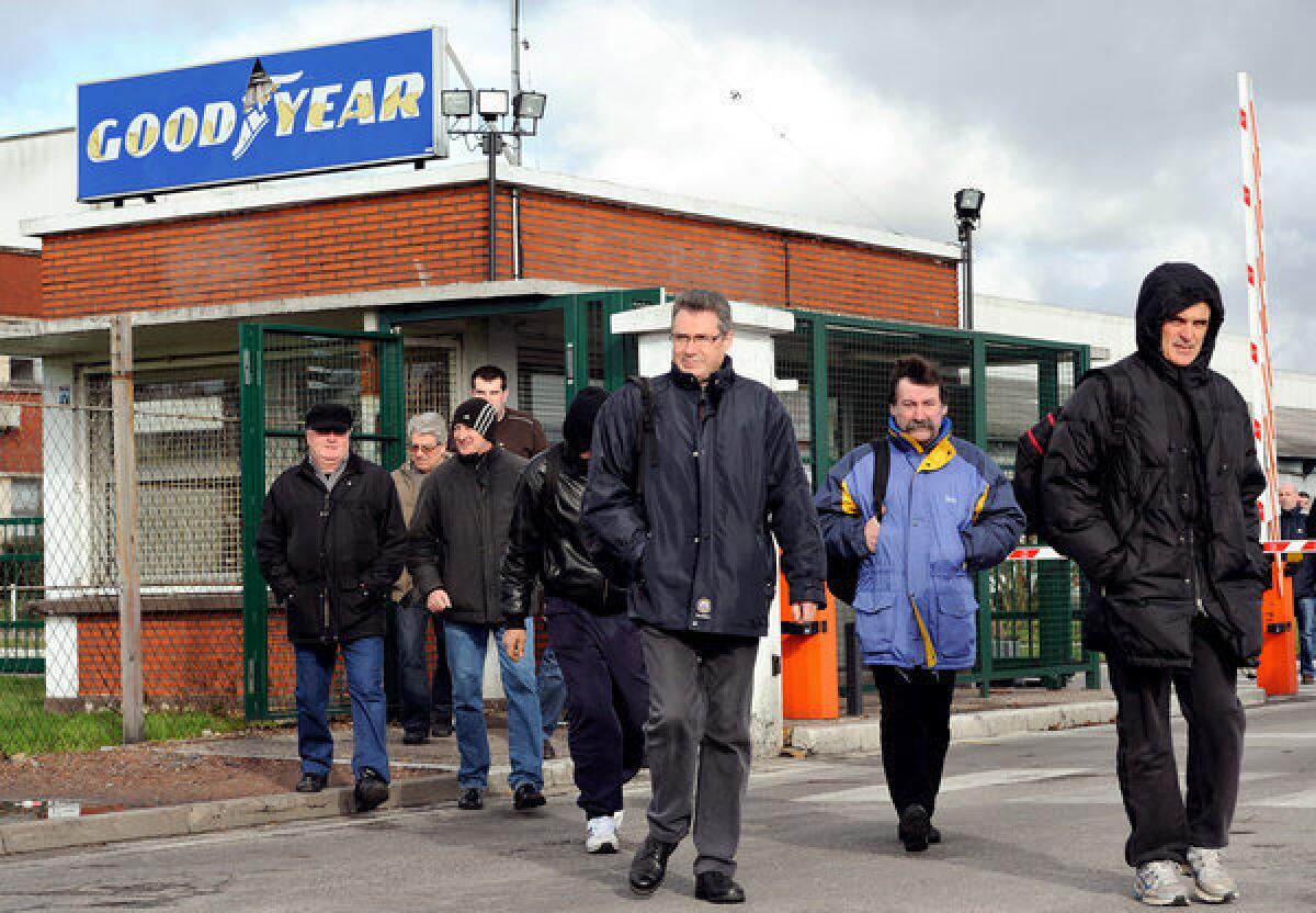 Workers leave a Goodyear tire plant in Amiens, France.